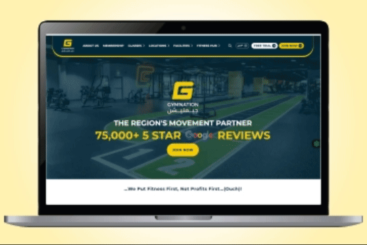 GymNation fitness website shown on a laptop